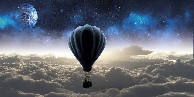 Hot air balloon rising above the clouds, symbolizing freedom, possibility, and self-determined movement.